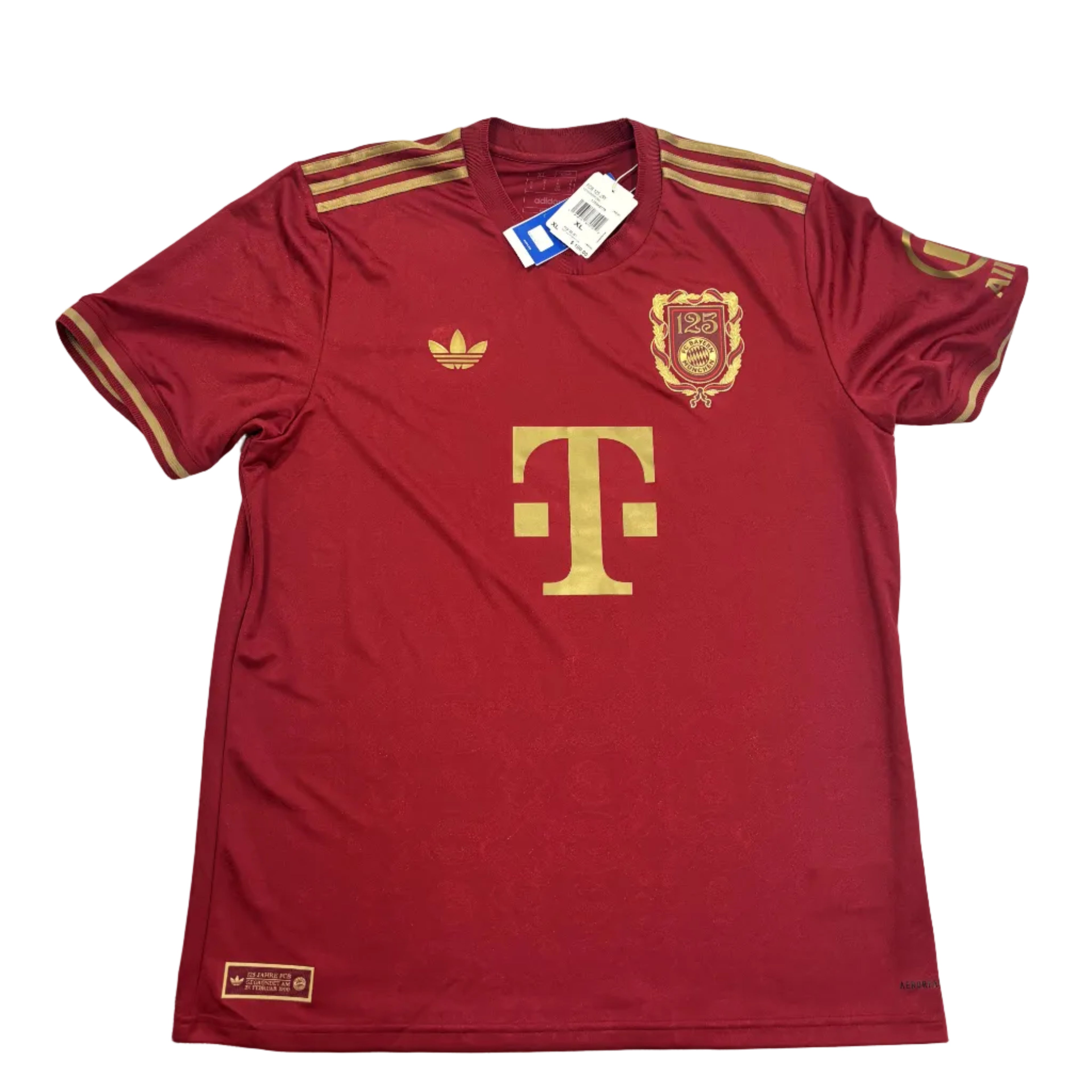 Red sports jersey with gold accents on a white surface