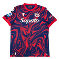 Red and blue sports jersey with branding on a white surface