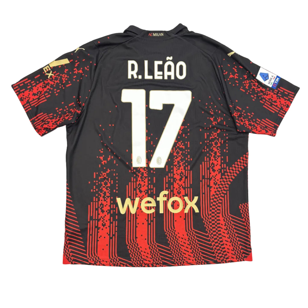 Black sports jersey with red patterns and 'R. Leóa' and number '17' on a white surface.