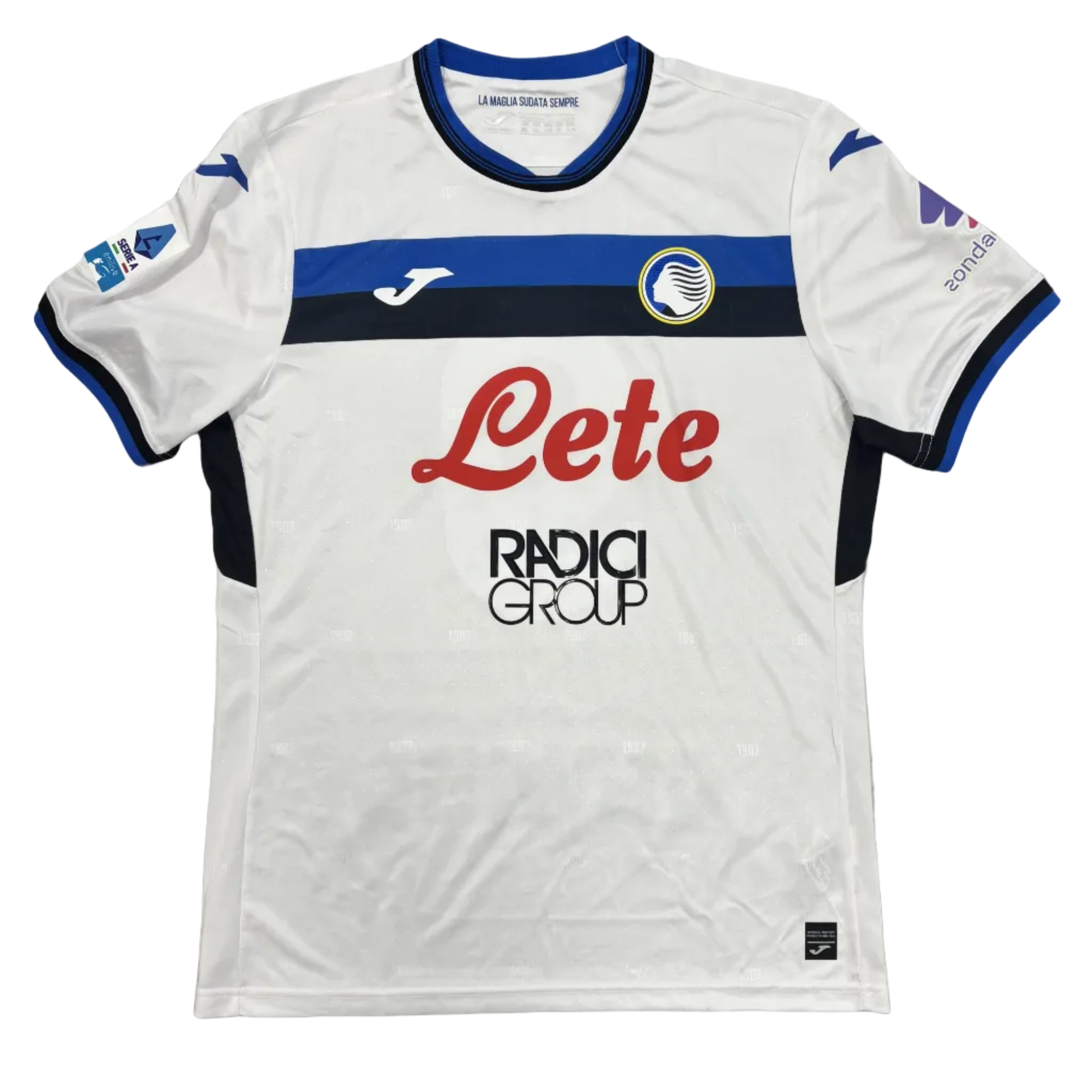 White sports jersey with blue and red accents on a gray surface