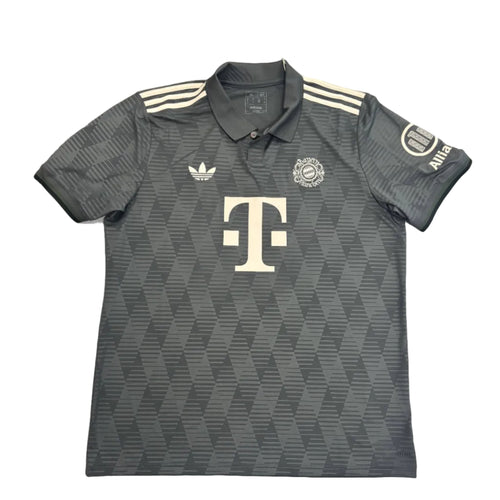 Gray Adidas polo shirt with a logo on a round white table