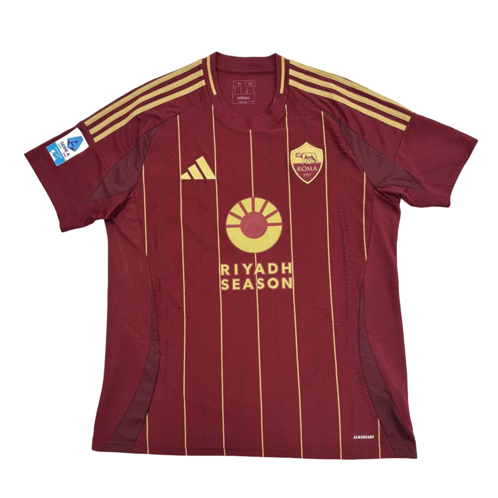 Maroon sports jersey with gold accents on a white surface, featuring 'Riyadh Season' text.