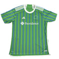 Green sports jersey with white and blue stripes on a round surface
