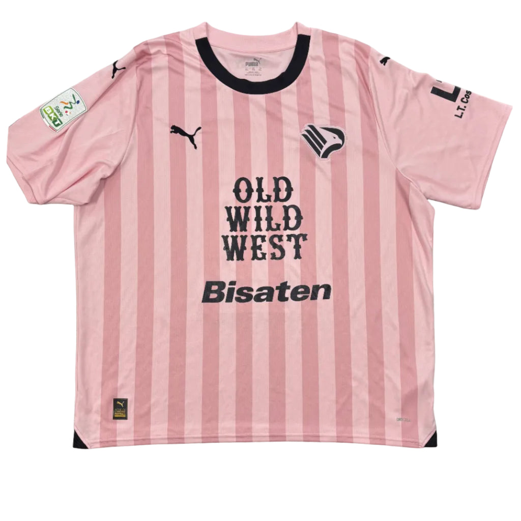 Pink and black striped jersey with text on a gray surface