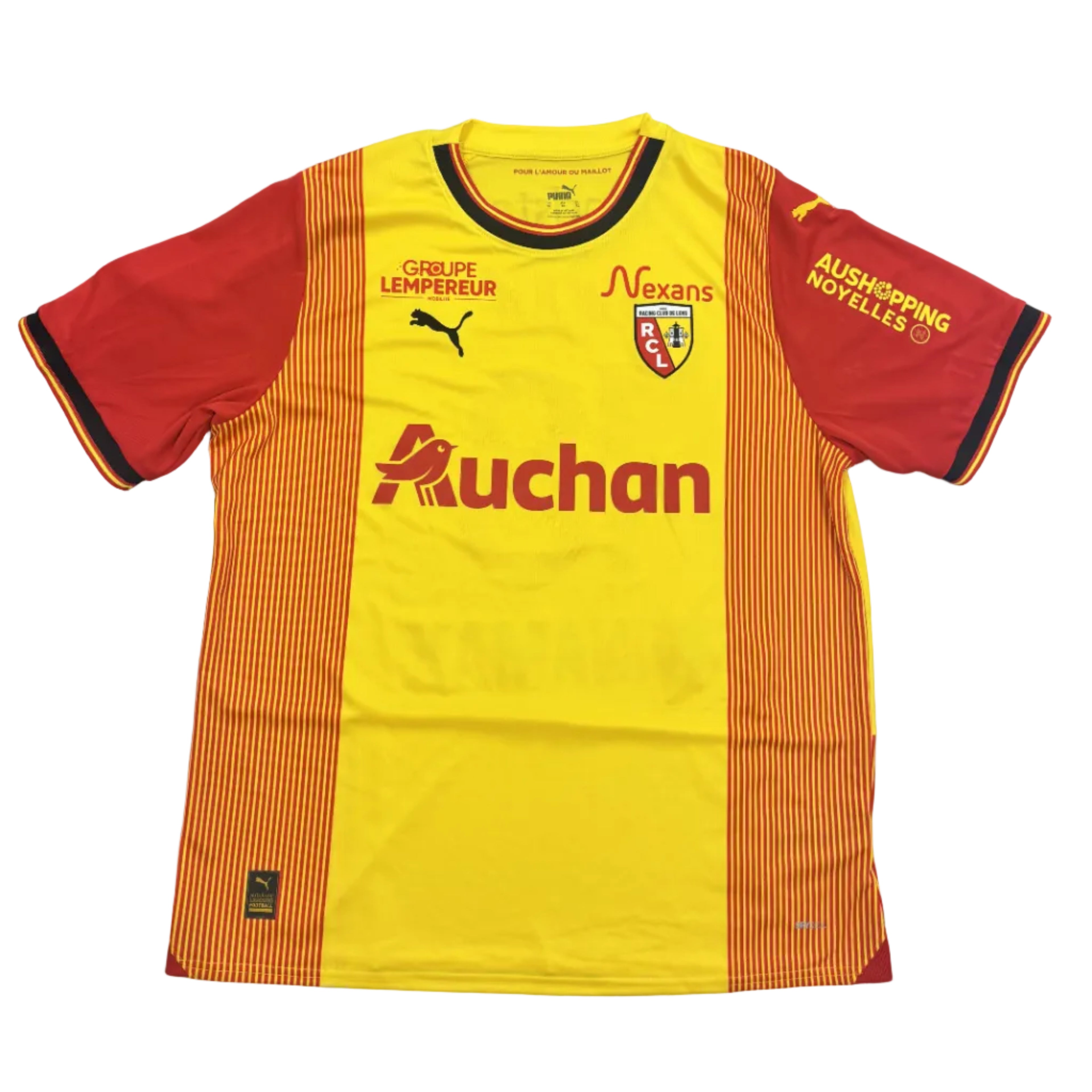 Yellow and red sports jersey with various logos on a round surface.