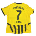 Yellow sports jersey with 'Dortmund' and 'Reyna' printed on a gray surface
