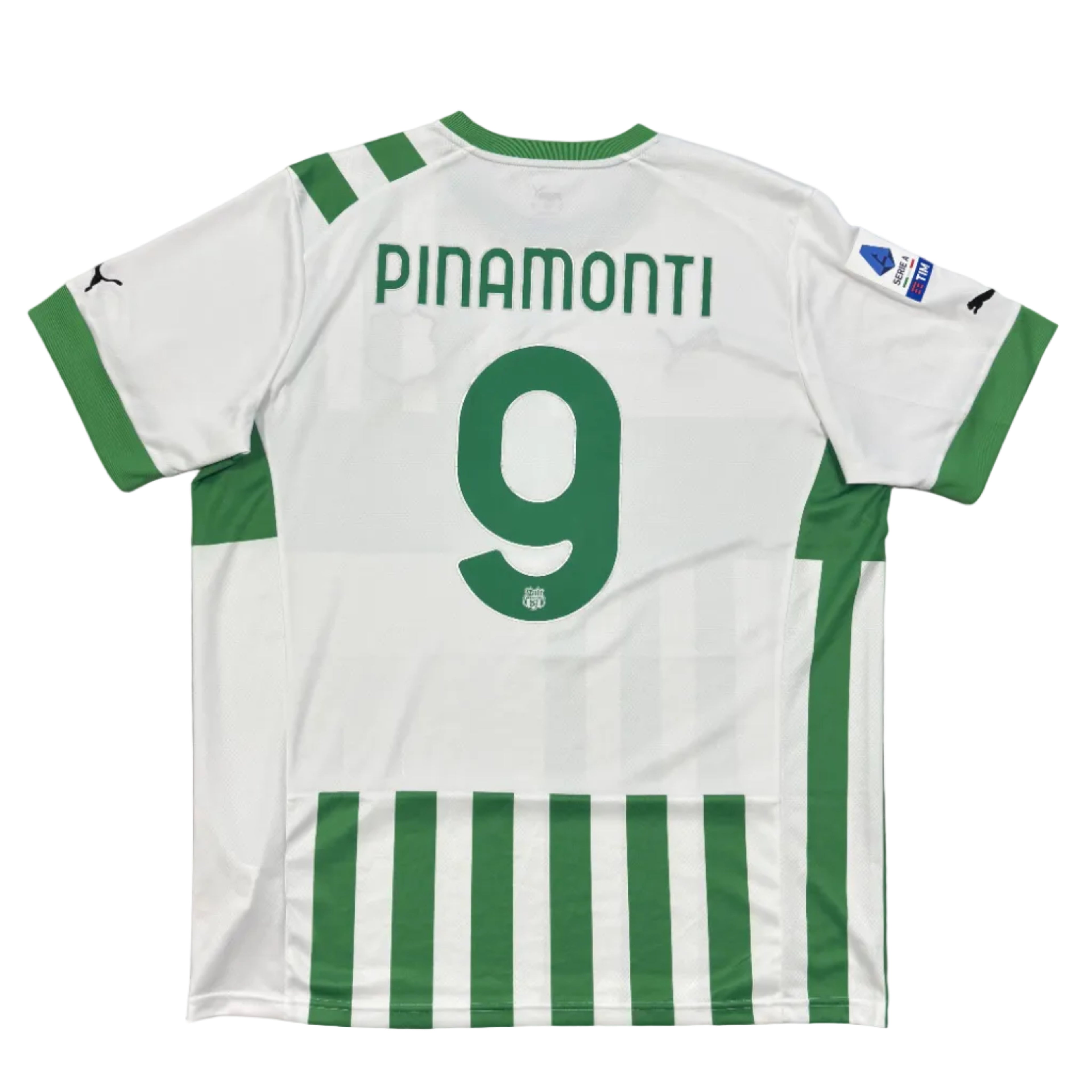 White sports jersey with green stripes and 'PINAMONTI' and number '9' on a gray surface.