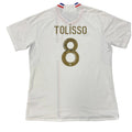 White sports jersey with 'Tolisso' and number '8' on a gray background