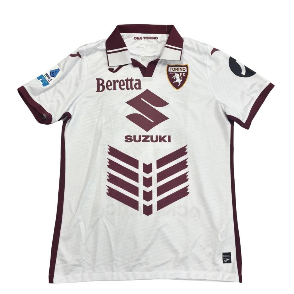 White sports jersey with maroon accents on a round table