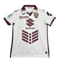 White sports jersey with maroon accents on a round table