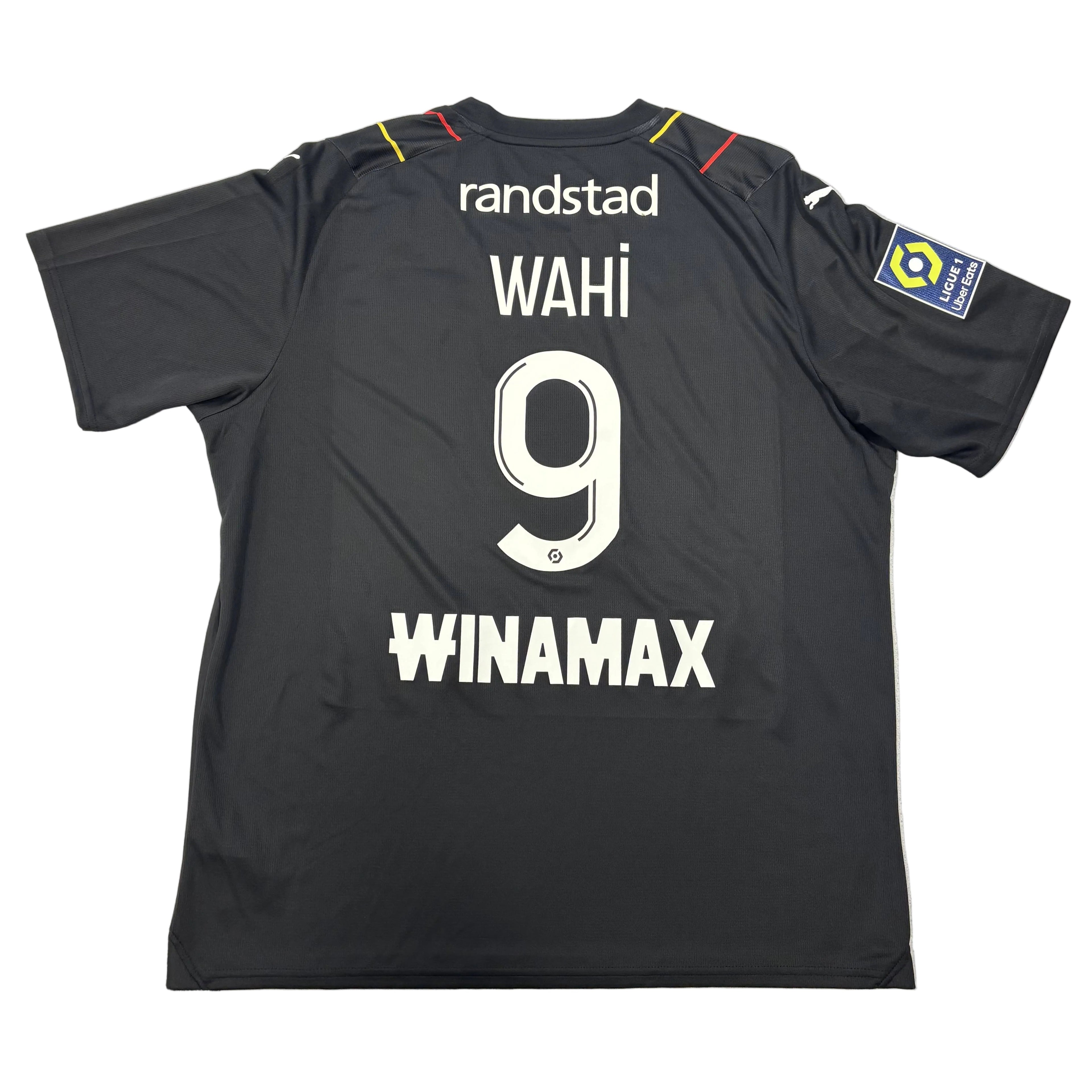 Black sports jersey with 'randstad', 'WAHI 9', and 'WINAMAX' text on a round surface.